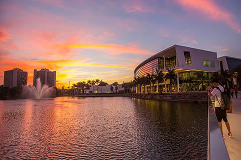 A photo of the Shalala Student Center during sunset at the University of Miami Coral Gables campus.