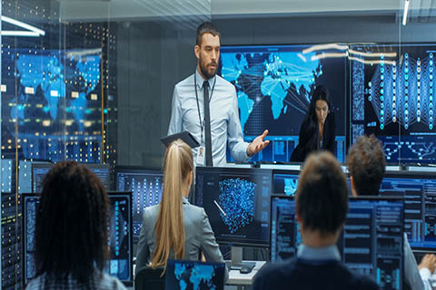 A stock photo of a security communications room. 
