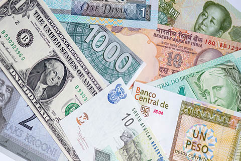 A stock photo of paper currencies from different countries.